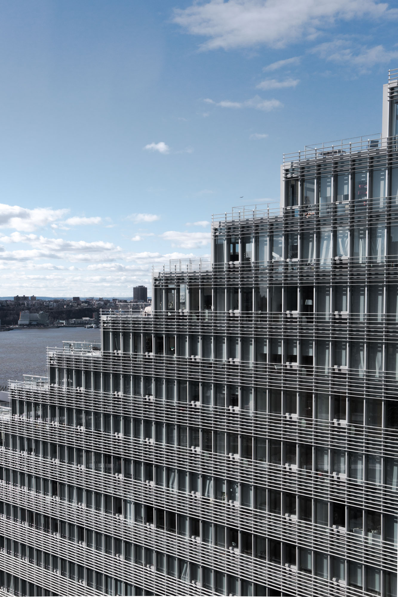a large body of water with a city in the background