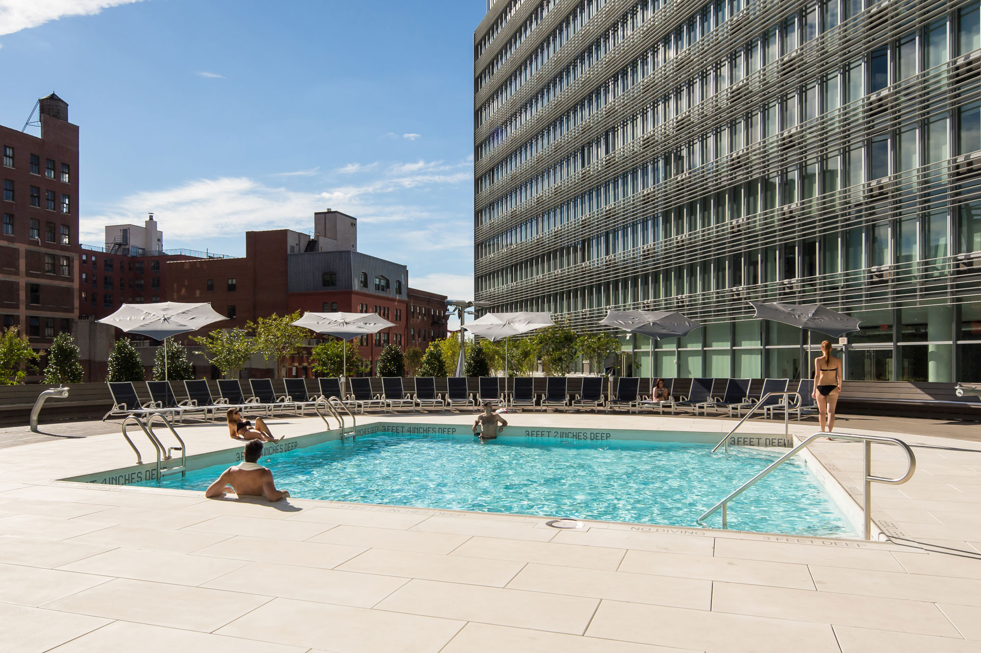 a group of people in a pool of water
