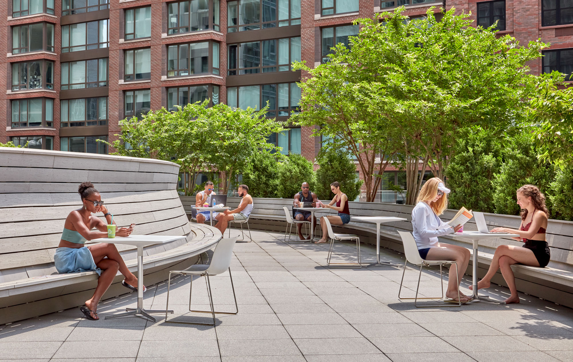 a group of people sitting on a bench