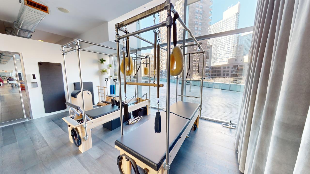 a room filled with furniture and a large window