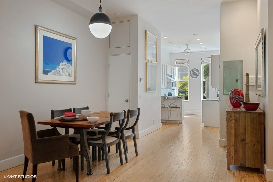 353 W 120TH ST 1 Manhattan, New York Rare opportunity to rent the owners' duplex (plus a finished basement) in a beautiful Harlem townhouse, half a block from Morningside Park. The recently-renovated apartment features 3 bedrooms plus a another room where you can set up a work area, and 2 1/2 baths.
The main entrance to the home is up the front stoop, one flight up from the sidewalk. The front door opens to a large open room that is over 60 feet long, with 10+ foot high ceilings, a white kitchen with natural stone countertops, a breakfast bar and Viking stainless steel appliances, a living area with a wood-burning fire place, a large dining area, a powder room, and a room with a door that can be closed off for use as a bedroom, work area or library. There is a deck off this floor, with a grill. The lower floor has three bedrooms and two bathrooms.
The Primary Bedrppm has direct access to the 850sf private garden, a walk-in-closet and a large bathroom that includes a soaking tub. The 575sf finished basement is below; it has a laundry room, a large freezer for extra storage, and the best childrens' activity room I have seen in NYC, with rock climbing holds, a suspended punching bag, handles to climb the ceiling, as well as other climbing materialsand you have it all to yourself.
Unobstructed Southern light all day in the front, total peace and quiet in the back. Abundant closet and storage space.
Cats and dogs are permitted; smoking is not.