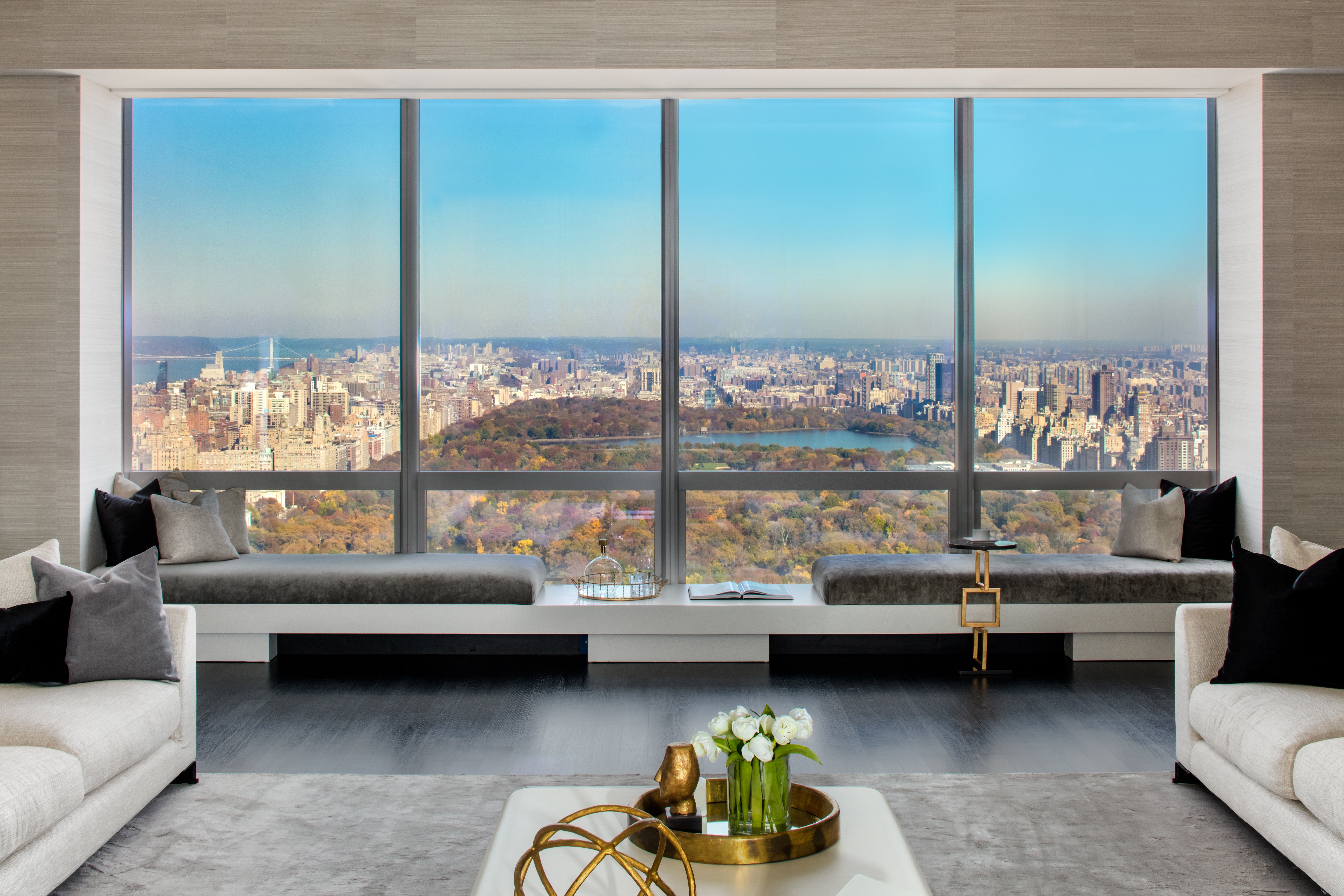 157 57TH ST W 59B Manhattan, New York The Half Floor three bedroom, three and a half bath residence delivers the sophistication, elegance and scale that one would expect from ONE57. The Grand Salon with soaring 11'10 ceilings and dimensions of 43 by 30 feet is the centerpiece of this exceptional floor plan , offering the ideal setting for formal entertaining and the display of fine art. The custom-designed floor to ceiling curtain wall accentuates full Central Park views to the north and captivating views of Manhattan including the Chrysler and Empire State Buildings to the south. Equally dramatic, the Master Suite of more than 1,000sf wraps around the entire eastern end of the residence also with views of Central Park and the iconic buildings of Midtown. Dornbracht fixtures, custom designed vanities by Thomas Juul Hansen and exquisite marble and onyx grace the sumptuous bathrooms of this home. The Chef's eat -in -kitchen is beautifully appointed with professional appliances and direct external ventilation by Miele as well as handcrafted custom cabinetry by Smallbone of Devizes. This home also has a service entrance placed away from the public spaces which offers discreet access. A state of the art, multi zone climate control system, via discreetly designed vents and linear diffusers, offers year round heating and cooling in each room.
