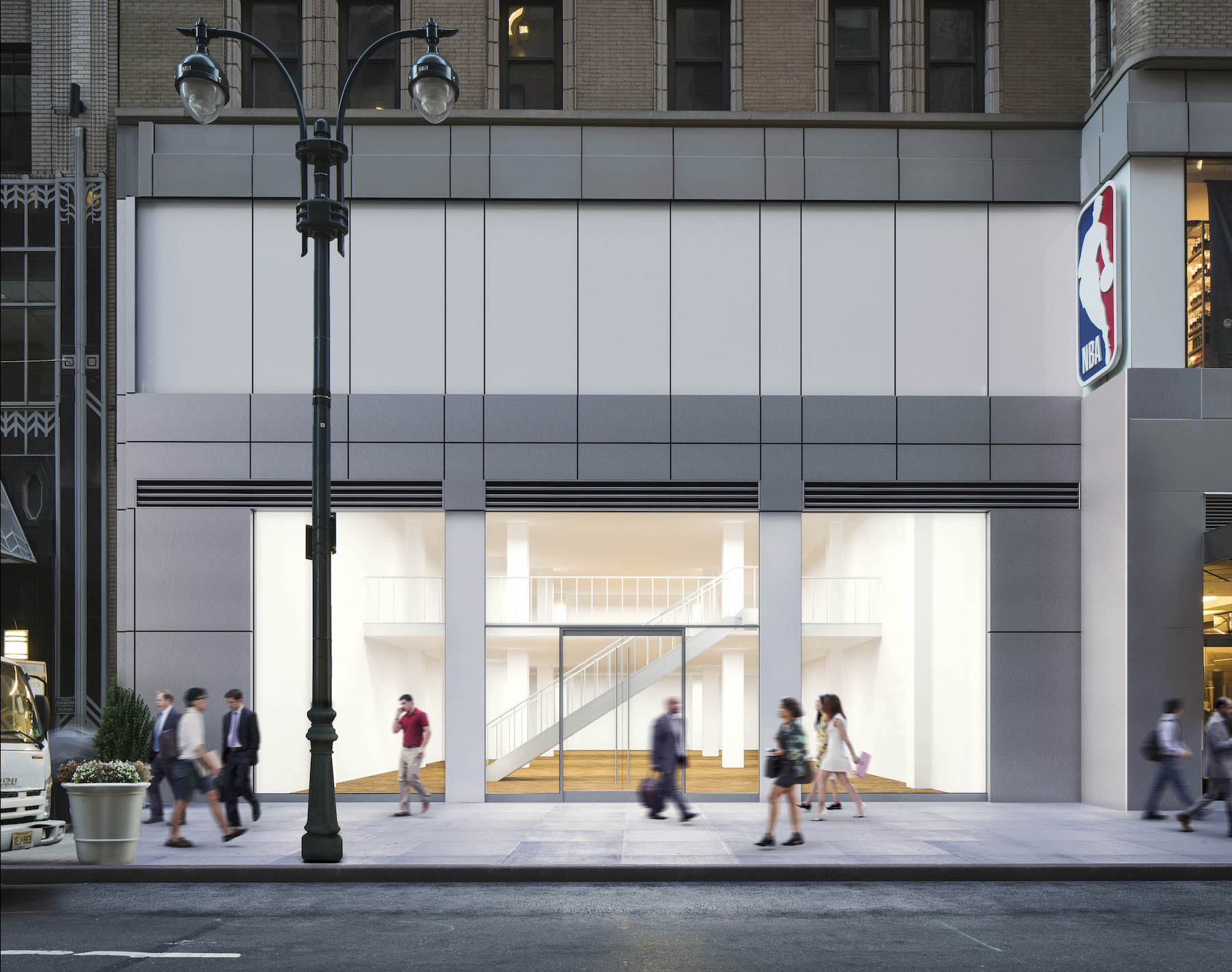a group of people crossing a street in front of a building